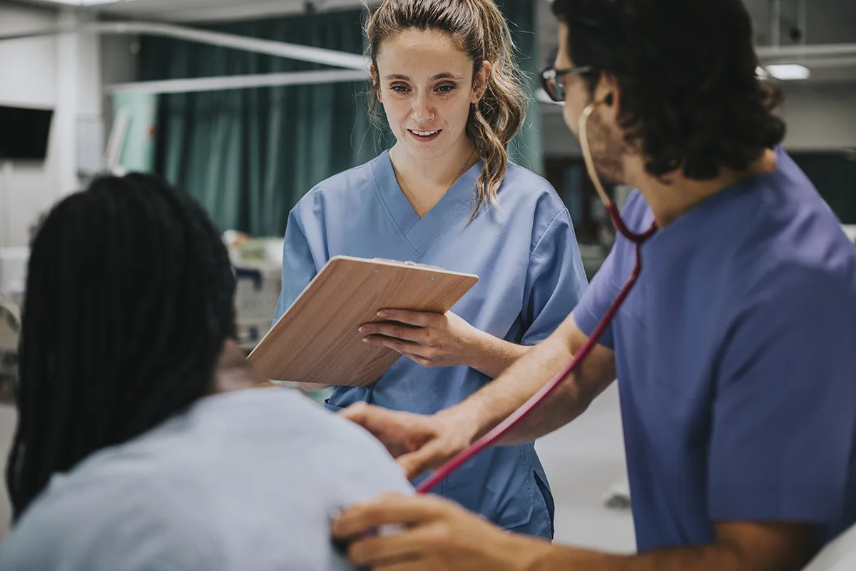 clinicians with a patient